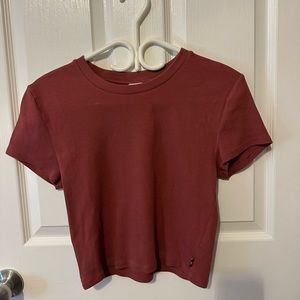 TNA tight short sleeve in burnt red colour. Size large